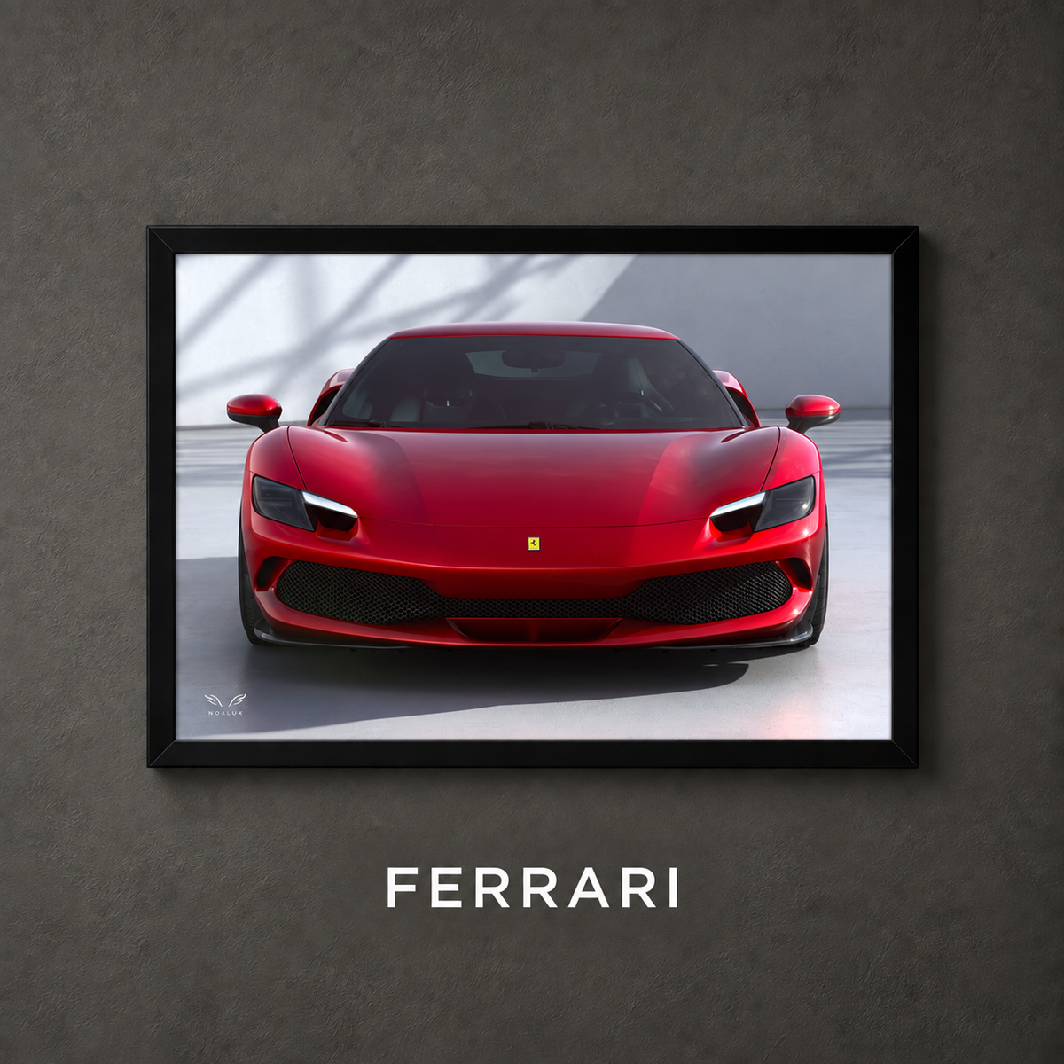 Framed Ferrari car poster on a charcoal wall with collection label