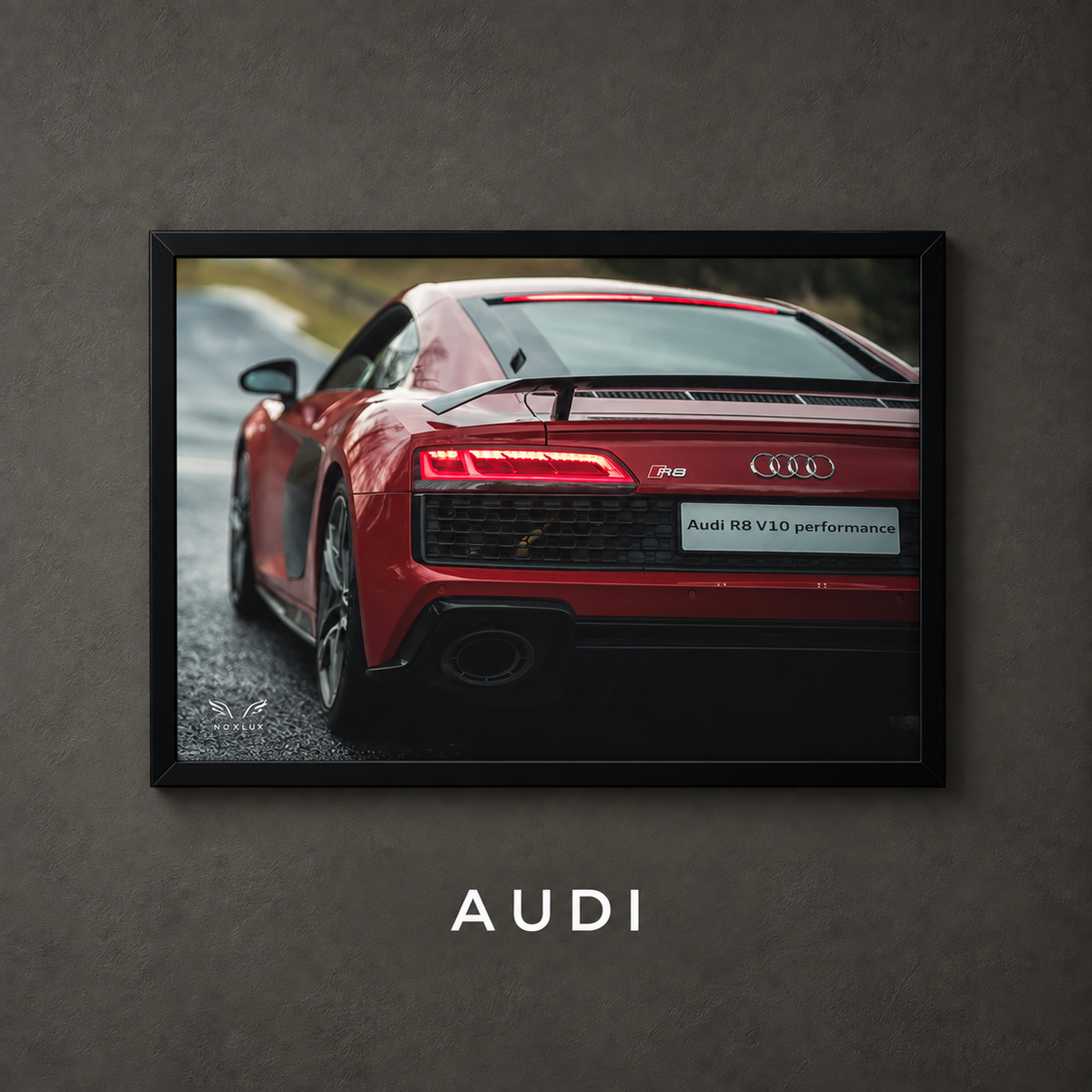 Framed Audi car poster on a charcoal wall with collection label