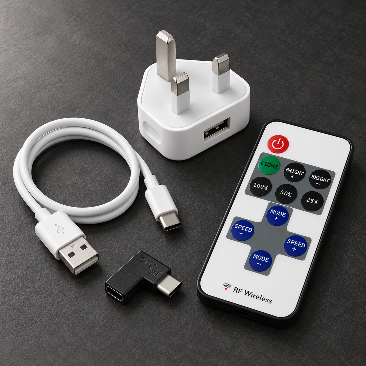 NOXLUX accessories including USB cable, UK plug, USB-C adapter and LED poster remote