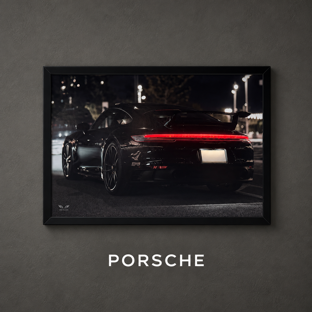 Framed Porsche car poster on a charcoal wall with Porsche collection label