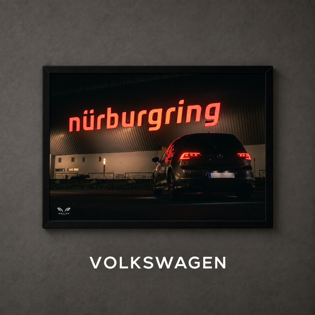 Framed Volkswagen car poster on a charcoal wall with collection label